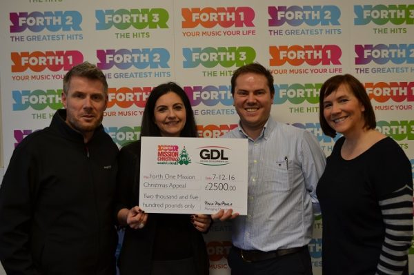 Kevin Mackenzie and Marisa Matos present GDL’s donation for this year’s Mission Christmas Appeal to Forth One’s breakfast presenters Boogie and Arlene.